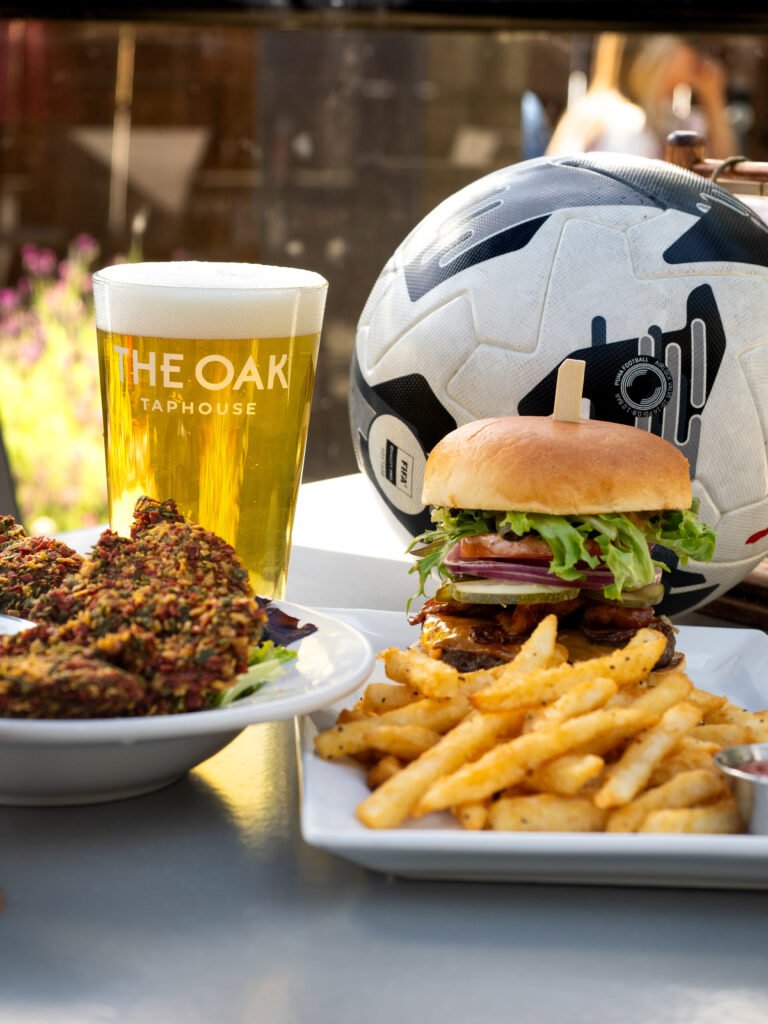 burger and beer with fired and chicken wings. Soccer ball